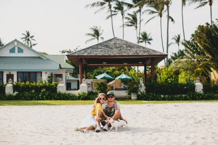 couple with pet at beach vacation rental