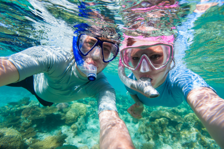 two people snorkeling