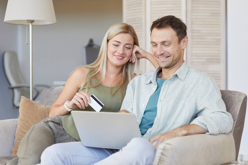 couple in laptop booking vacation rental condo