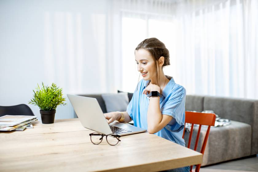 woman on laptop booking vacation rental property in florida