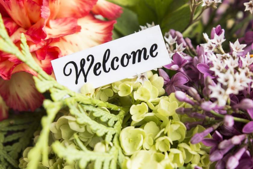 welcome basket with flowers for vacation rental guests